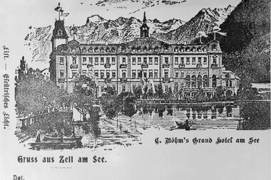 Historical photo of the Grand Hotel by the lake in Zell am See from 1896, with mountain scenery in the background.