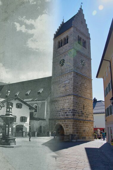 Historic view of the church in Zell am See with a notable clock tower and surrounding old town.