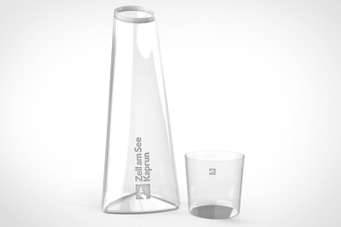 Clear pitcher and drinking glass on a white background, elegant design. | © Zell am See-Kaprun & Studio F. A. Porsche